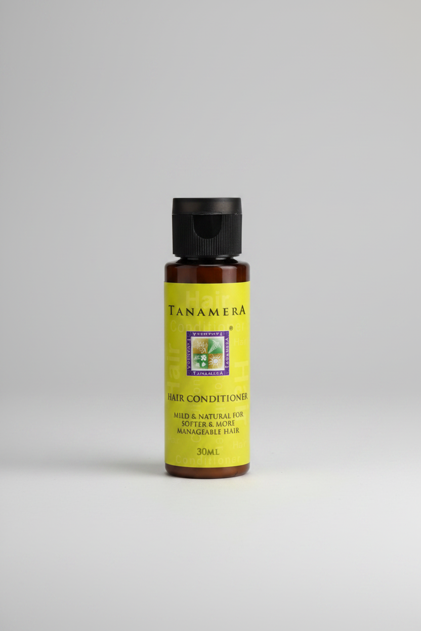 Tanamera hair conditioner bottle with green label and black cap on white background